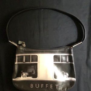 Icon double sided image of Buffet leather handbag. L:9x H: 6x W: 1.5